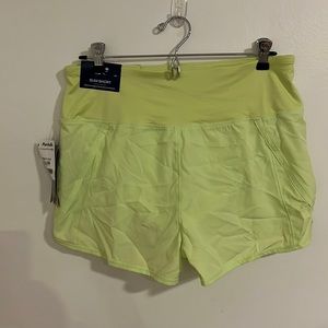 Reebok women’s running short. Built-in panty. Neon/chartreuse. New with tags